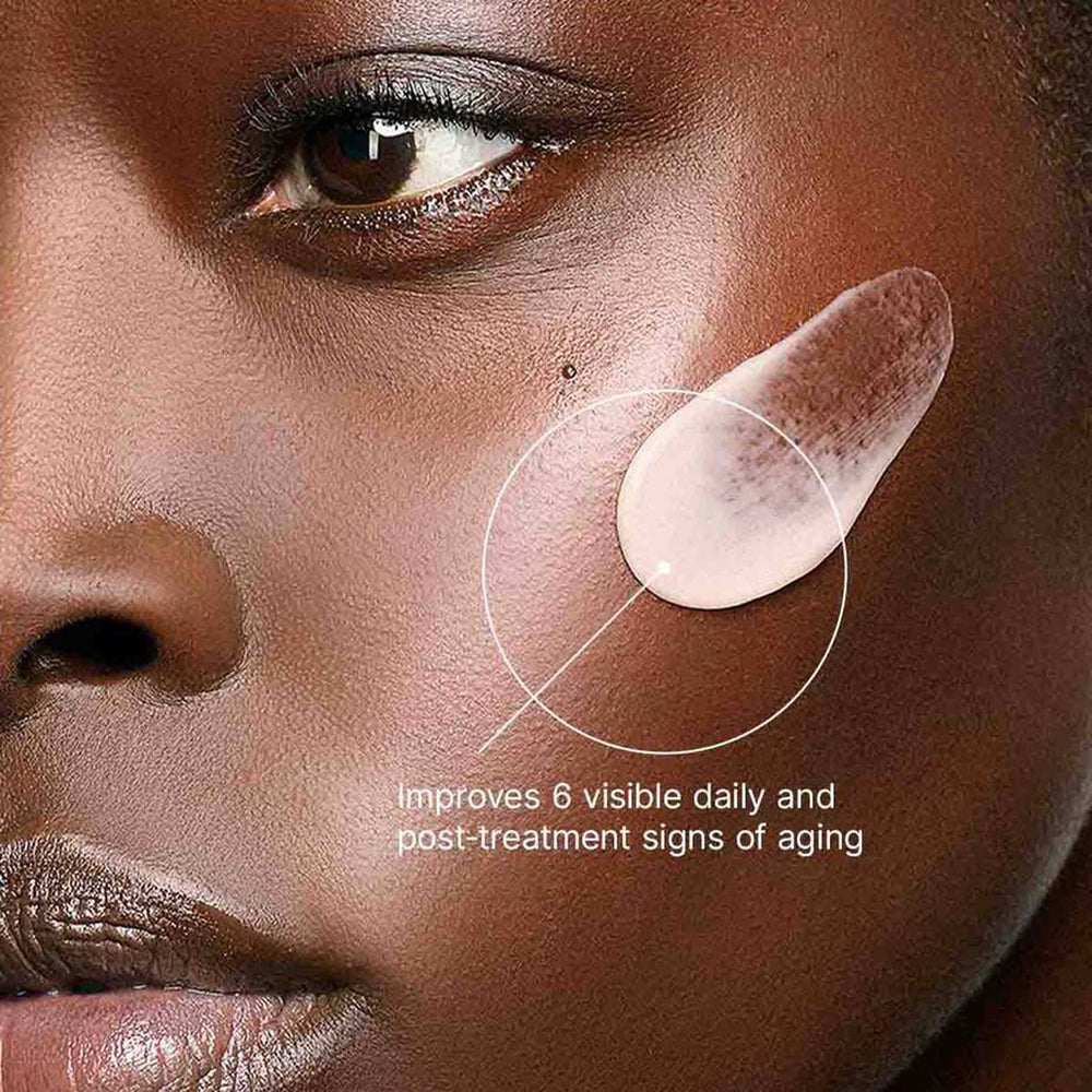 Close-up of a woman's face with skincare product application, showing text about improving signs of aging.