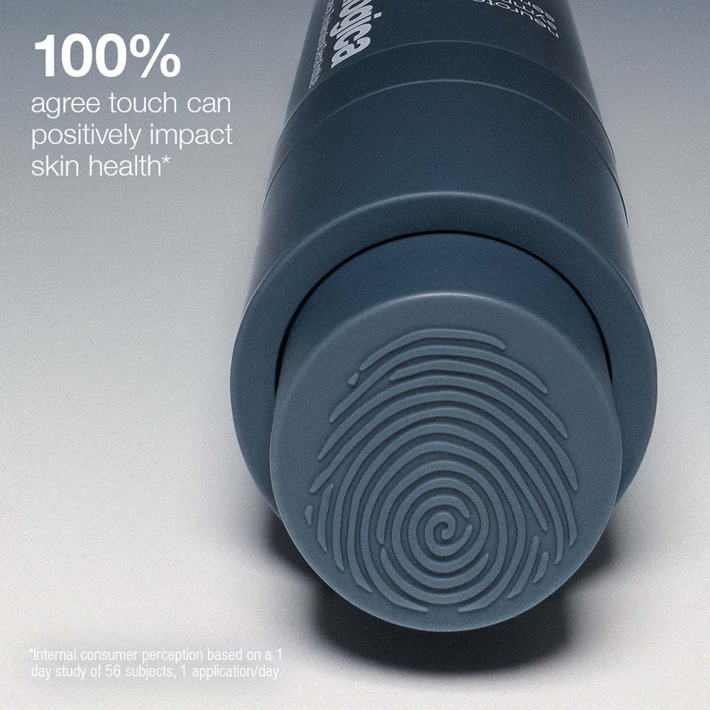 Gray textured bottle with text about touch impact on skin health on a light gray background