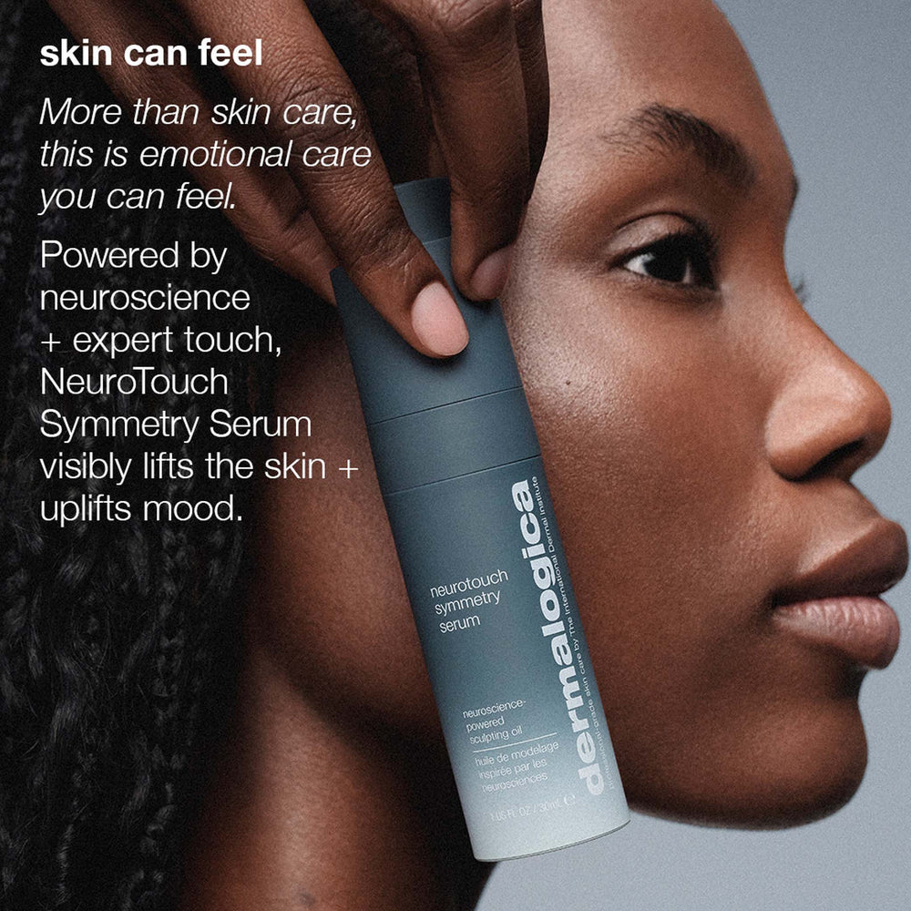 Dermalogica NeuroTouch Symmetry Serum being held by a hand with text about emotional care and neuroscience.
