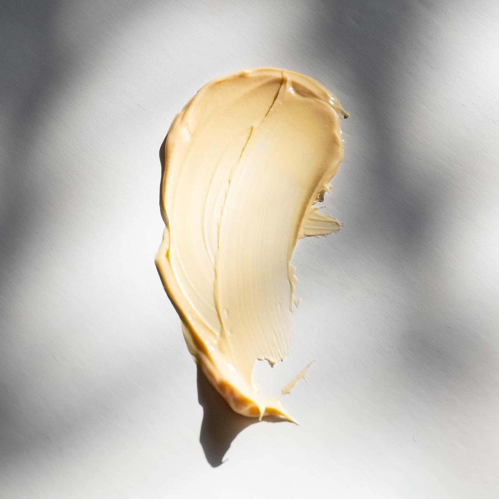 Swatch of multivitamin power recovery masque on a light gray background